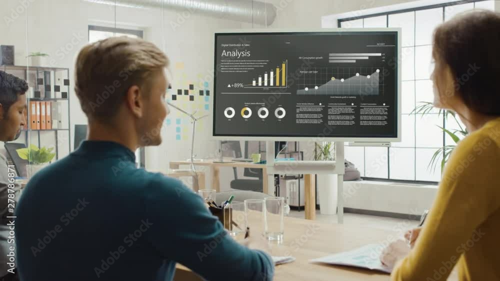 Poster team of analytics, economists and young businesspeople hold meeting presentation use shows digital i