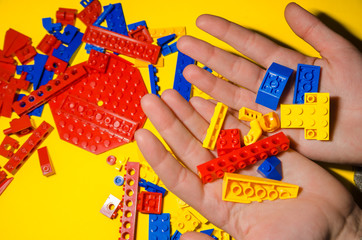 toy bricks in hands