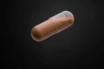 Floating or levitate Transparent capsule pills in the thin air