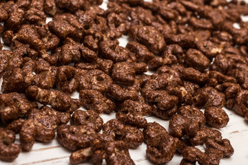 Dry cereal breakfast in the form of letters of the English alphabet on a white background.