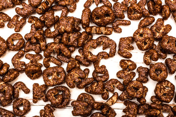 Dry cereal breakfast in the form of letters of the English alphabet on a white background.
