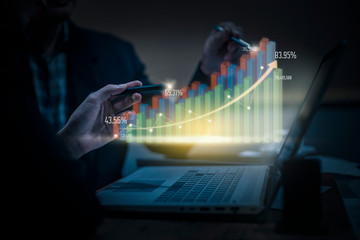 businessman and businesswoman discussing virtual reality profit graphic. Concept of Business technology and digital marketing.