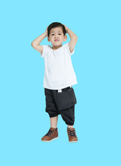 Closeup asian kid in disappointed feel isolated on blue background