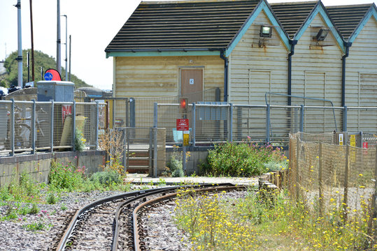 Storage sheds on the bend of a beach railway in Brighton, England.