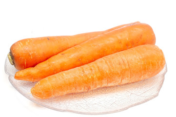 Carrots on a plate isolated on white
