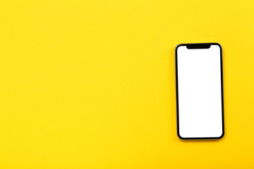 Smartphone on yellow background