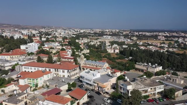 Aerial view flying over Paphos City, Cyprus and the Saint Theodore church and gallows