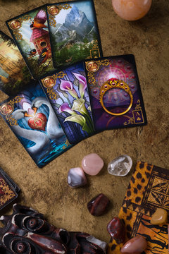 JULY 12, 2019 - SAINT PETERBURG, RUSSIA: lenormand cards by Ciro Marchetti with gemstones. studio shot