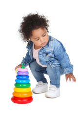 Beautiful baby girl with rainbow toy on white background