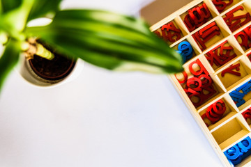 Montessori method is an educational model, word written with wooden letters.