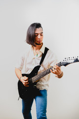 Fototapeta premium Electric guitar and guitarist playing, isolated on white background copy space.