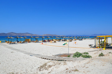 beach with umbrellas and chairs on beach