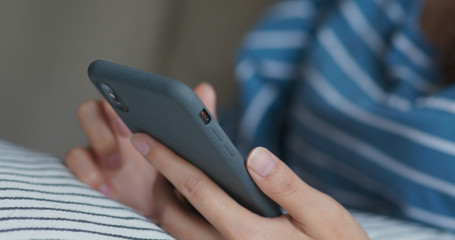 Woman use of mobile phone at home