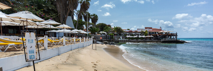 Sunbeds under umbrellas, panorana