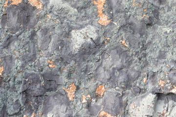 Gold ore texture. Gray stone background. The surface of the marble with a brown.