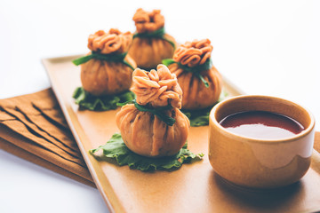 Crispy Potli Samosa or veg money bags are delicious Indian snacks of spiced aloo and mix veggies Or Meat/kheema  stuffed in flaky dough. It's a great creative starter or appetiser. served with ketchup