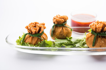 Crispy Potli Samosa or veg money bags are delicious Indian snacks of spiced aloo and mix veggies Or Meat/kheema  stuffed in flaky dough. It's a great creative starter or appetiser. served with ketchup