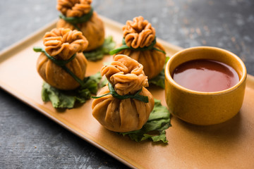 Crispy Potli Samosa or veg money bags are delicious Indian snacks of spiced aloo and mix veggies Or Meat/kheema  stuffed in flaky dough. It's a great creative starter or appetiser. served with ketchup