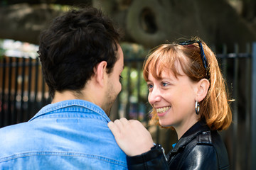 Young couple with their backs towards camera