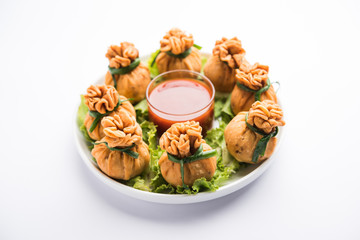 Crispy Potli Samosa or veg money bags are delicious Indian snacks of spiced aloo and mix veggies Or Meat/kheema  stuffed in flaky dough. It's a great creative starter or appetiser. served with ketchup