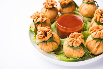 Crispy Potli Samosa or veg money bags are delicious Indian snacks of spiced aloo and mix veggies Or Meat/kheema  stuffed in flaky dough. It's a great creative starter or appetiser. served with ketchup