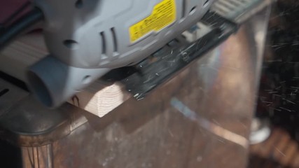 Slow Motion. Cutting timber with a circular saw. Wood. Professional carpenter. Power tool. Hand