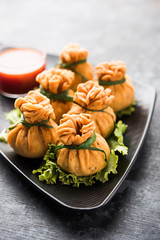 Crispy Potli Samosa or veg money bags are delicious Indian snacks of spiced aloo and mix veggies Or Meat/kheema  stuffed in flaky dough. It's a great creative starter or appetiser. served with ketchup