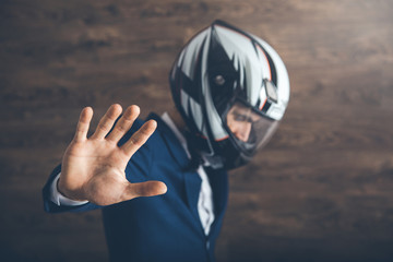 man motorcycle rider hand stop sign