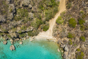 Aerial view of coast of Curaçao in the  Caribbean Sea with turquoise water, white sandy beach and...