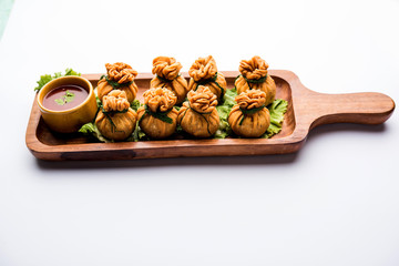 Crispy Potli Samosa or veg money bags are delicious Indian snacks of spiced aloo and mix veggies Or Meat/kheema  stuffed in flaky dough. It's a great creative starter or appetiser. served with ketchup
