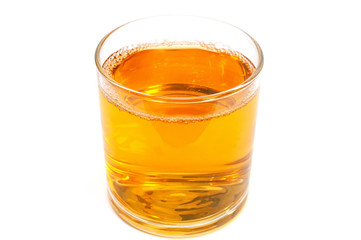 Apple juice in a glass isolated on white