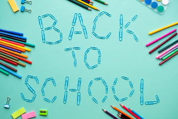 School elements on blue background with text back to school