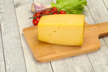 Hard yellow tasty cheese brick