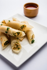 Paneer chilli cigar are crispy rolls stuffed with paneer which is an interesting starter for any party. served with tomato ketchup. selective focus