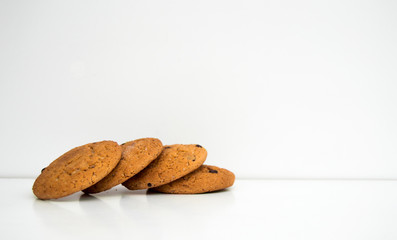 Four cookies on a white background. Horizontal photo