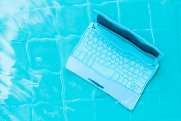 Minicomputer at the bottom of the pool. The concept of a lot of work at work. Blur abstract...