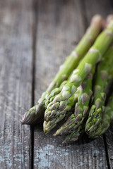 Bunch of fresh asparagus on wooden table