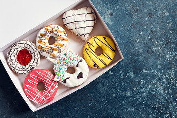 Donuts over dark background