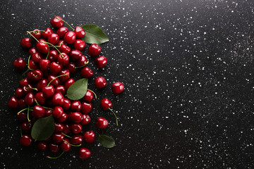 Bunch of fresh organic sweet cherries on textured background. Clean eating concept. Healthy...
