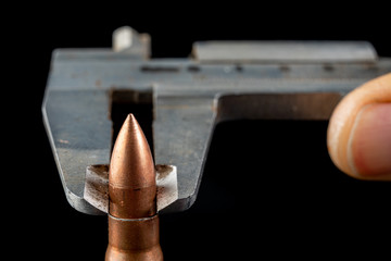 Ammunition of a high-speed rifle. Measurement using a rifle bullet diameter caliper.