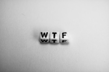 White cubes with word WTF on white background