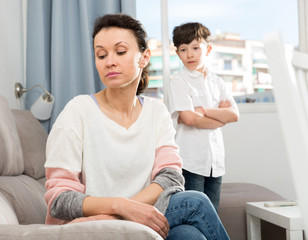 Obraz premium Upset woman after quarrel with son