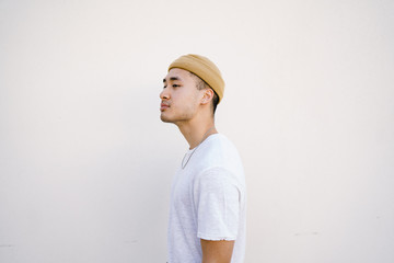 Side view of young man standing outdoors