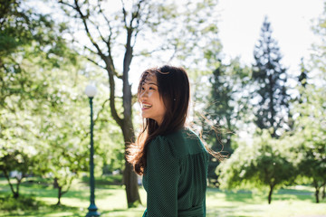 Smiling young woman standing outdoors