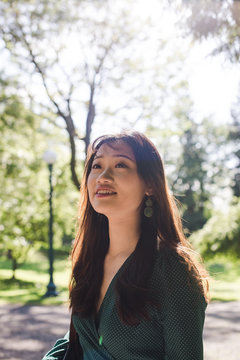 Smiling young woman standing outdoors