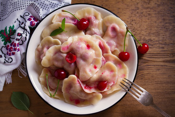 Dumplings, filled with strawberries. Pierogi, varenyky, vareniki, pyrohy - dumplings with filling, popular dish in many countries