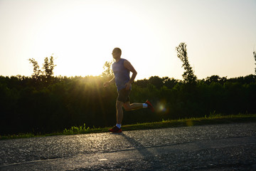 Running man silhouette in sunset time. Healthy lifestyle. sunlighte, sunrise, golden-hour.