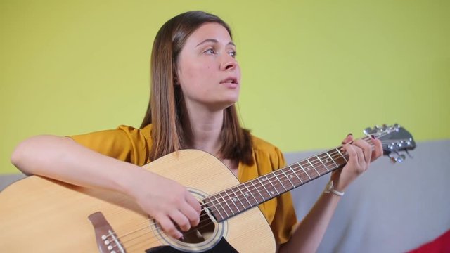 portrait, girl playing guitar, talking