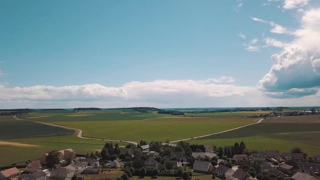Flight over a country village and its fields