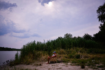 man and child by the river